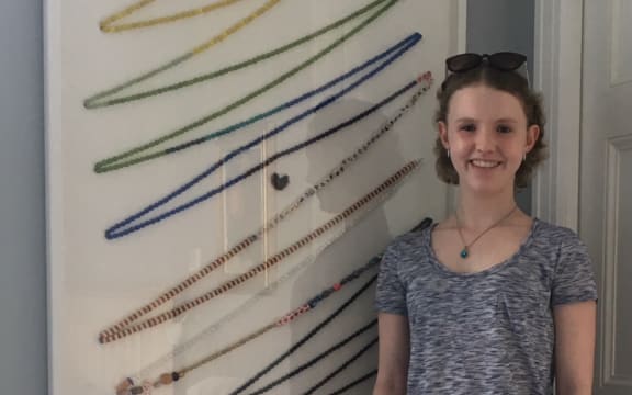 Lara Cooke with her beads of courage