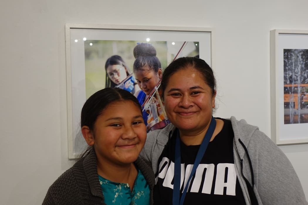 Nina Nimarota (R) and her daughter. Her daughter's photo is part of the Virtuoso Strings photo exhibition at Pataka in Porirua.