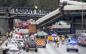 Emegency crews work at the scene of a Amtrak train derailment on December 18, 2017 in DuPont, Washington.