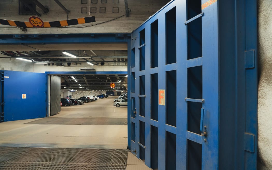 Security doors in the Merihaka civil defence shelter are pictured on March 27, 2025 in Helsinki, Finland. Swimming pools, playgrounds, and even amusement parks: Finland's underground facilities, which can serve as bomb shelters, are inspiring many of the Nordic country's allies as Europe seeks to strengthen its war preparedness. (Photo by Alessandro RAMPAZZO / AFP) / TO GO WITH AFP STORY BY ANNA KORKMAN