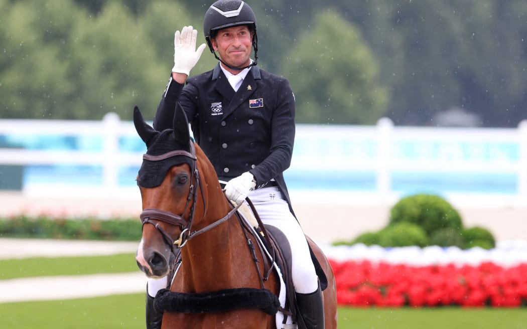 New Zealand's Tim Price on Falco competes in the equestrian dressage during the Paris 2024 Olympic Games at the Chateau de Versailles, in Versailles, in the western outskirts of Paris, on July 27, 2024. (Photo by Pierre-Philippe MARCOU / AFP)