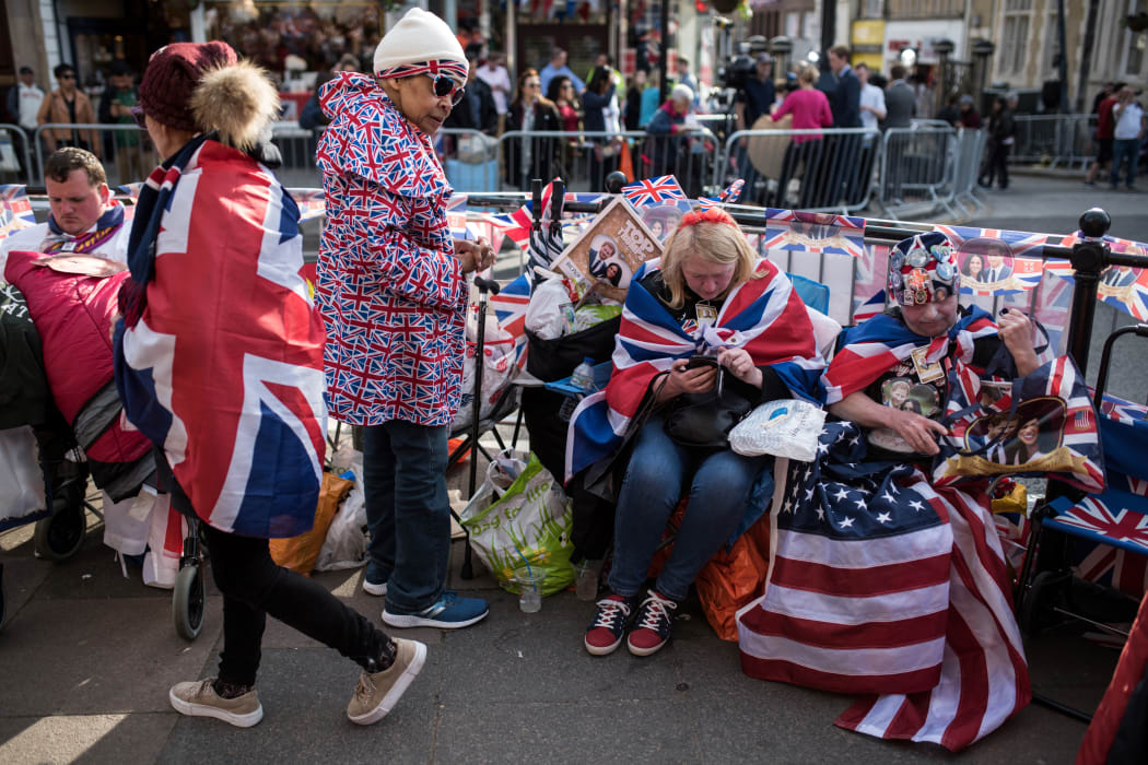 Royal fans wait along the proposed route of the carriage procession for Britain's Prince Harry and US actress Meghan Markle, in Windsor.