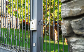 Metal gates and security camera.