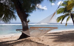 9921975 - hammock on a tropical beach, rarotonga, cook islands