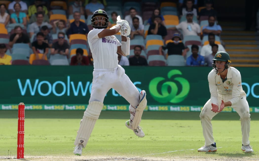 India's batsman Cheteshwar Pujara plays a shot on day five of the fourth cricket Test match between Australia and India at The Gabba in Brisbane on January 19, 2021.