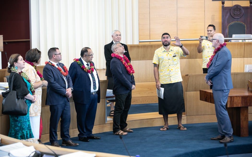 A cross-party group of New Zealand MPs is shown around Samoa's Parliament chamber. 11 July 2023.