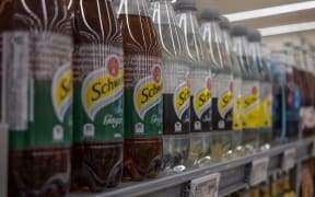 Softdrink bottles on supermarket shelves