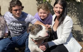 Quaid Brennan and Millie Russell, with eight-year-old Ariella Russell, said Onyx was a “loving dog”.