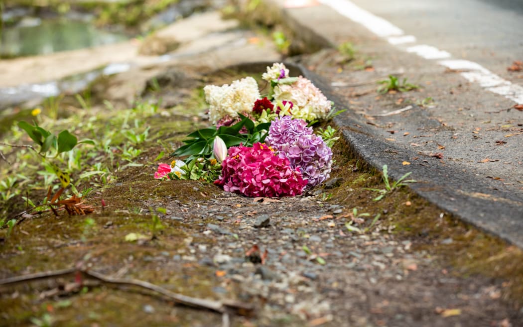 Flowers at the scene where car was washed away