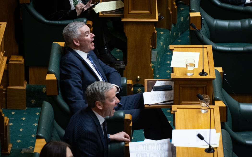 National Party MPs Andrew Bayly and Scott Simpson bray at Willie Jackson's answers during Question Time.