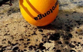 The first cable buoy reaching land in Rutaki, Rarotonga, Cook Islands.