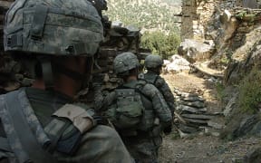 US soldiers patrol early in Korengal valley in Afghanistan's Kunar province in 2009.