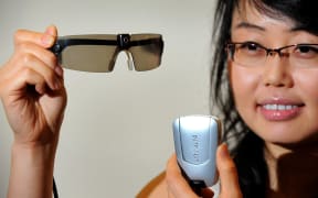 Researcher Mandy Li displays a prototype bionic eye designed to help patients suffering from degenerative vision loss caused by retinitis pigmentosa and age-related macular degeneration at University of Melbourne on March 30, 2010. AFP PHOTO/William WEST