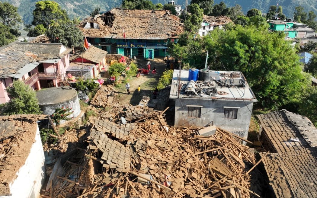 An aerial picture shows damaged buildings in Jajarkot district on November 4, 2023, following an overnight 5.6-magnitude earthquake. At least 132 people were killed in an overnight earthquake of 5.6-magnitude that struck a remote pocket of Nepal, officials said on November 4, as security forces rushed to assist with rescue efforts. (Photo by Harihar SINGH RATHOR / AFP)