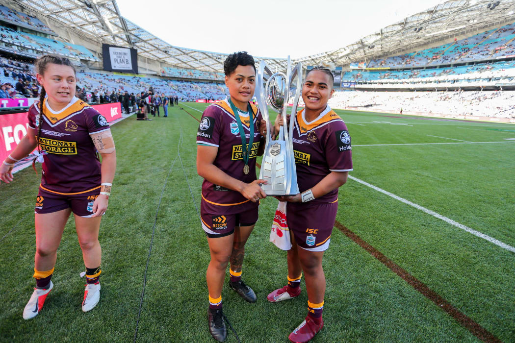 Kimiora Nati and Ngatokotoru Arakua holding the Premiership trophy