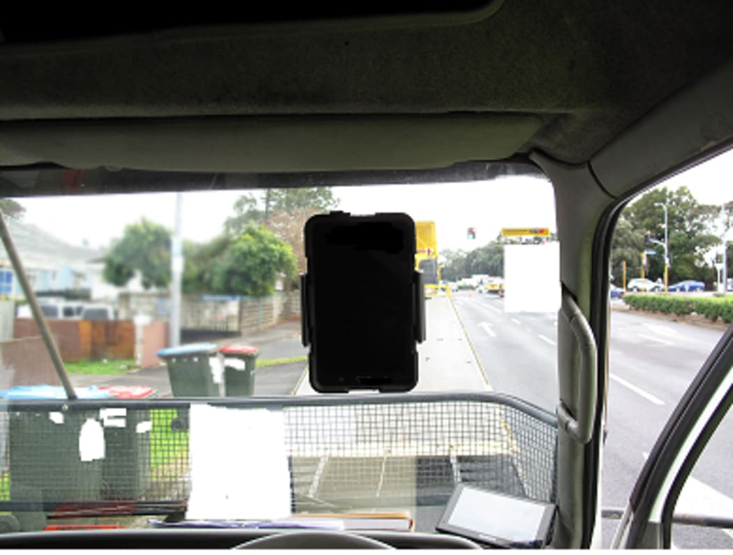 The A4-sized tablet stuck on the windscreen directly in front of the driver.