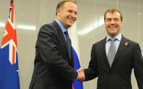 John Key shakes hands with Dmitry Medvedev at a bi-lateral meeting in Japan after trade talks started in 2010.