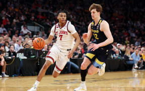 Simeon Wilcher #7 of the St. John's Red Storm dribbles against Ben Gold #12 of the Marquette Golden Eagles in the second half of a semifinal game during the Big East Men's Basketball Tournament at Madison Square Garden on March 14, 2025