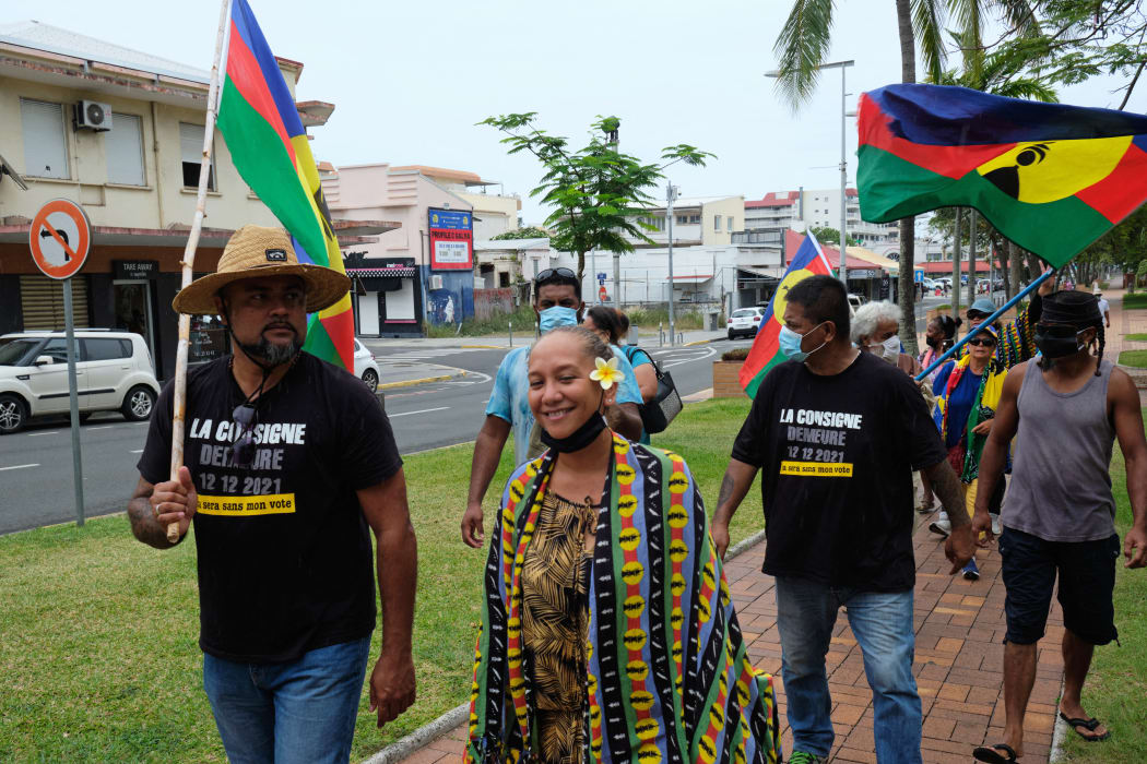 Independentists demonstrate as they hold Kanak flags the morning after the self determination referendum in Noumea, in the French South Pacific territory of New Caledonia