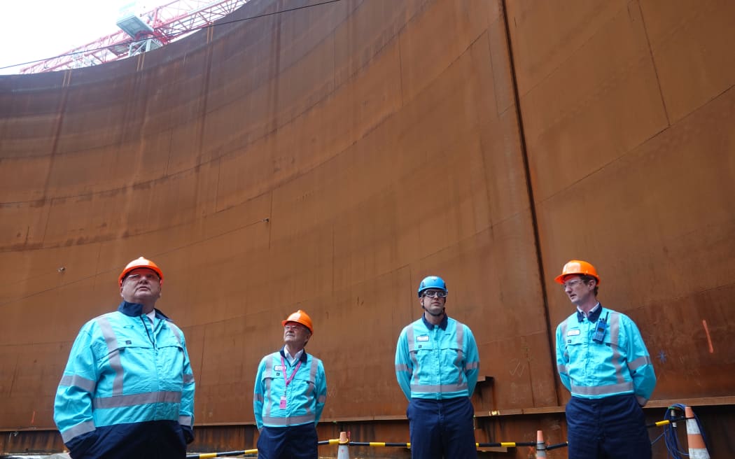 Regional Development Minister Shane Jones with Channel Infrastructure chairman James Miller, chief executive Rob Buchanan and operations general manager Jack Stewart inside the 30-million-litre jet fuel tank.