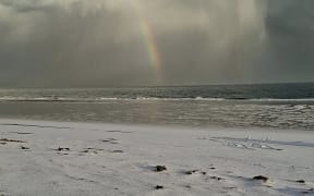 The beach at Pouto, south of Dargaville, is blanketed in ice after a freak hail storm.