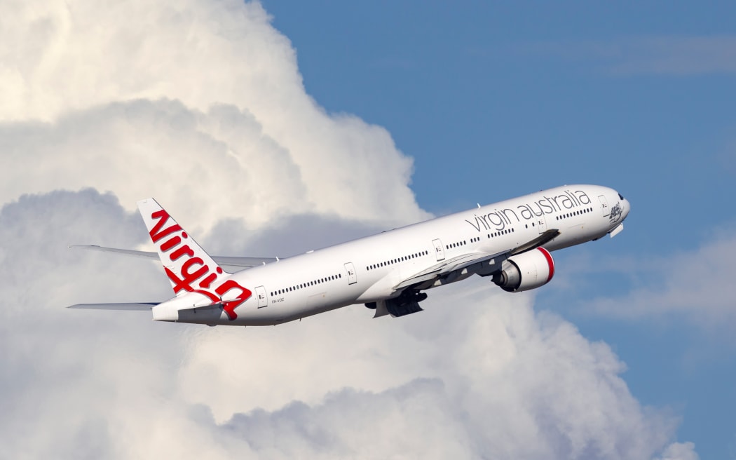 A Virgin Australia Airlines Boeing 777-300 aircraft taking off from Sydney Airport.
