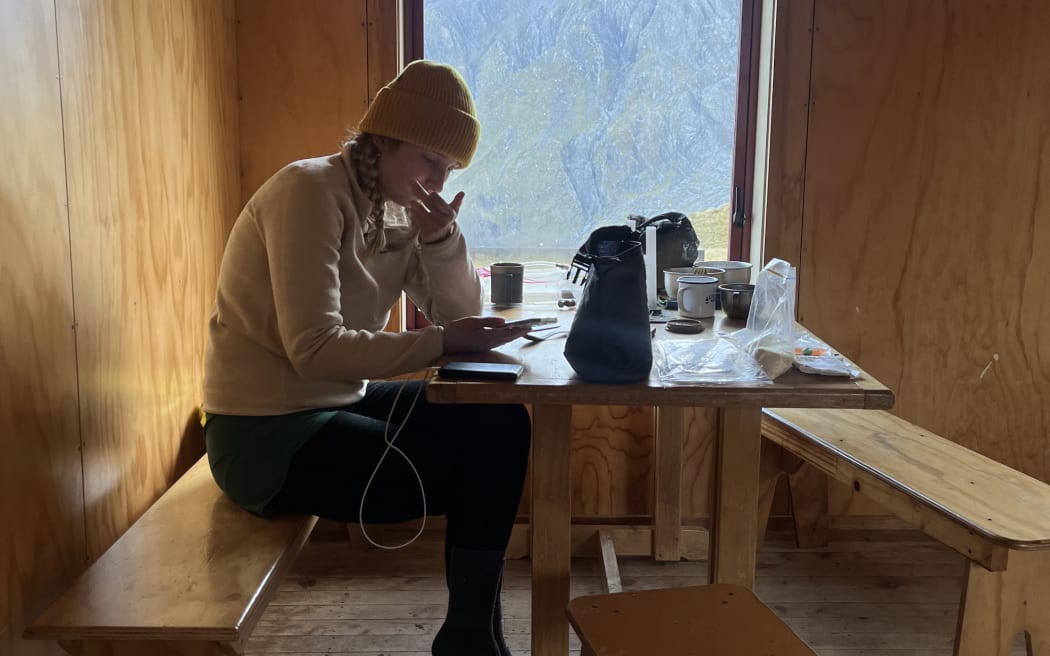Student Rosa Watt checked her NCEA results from Brewster Hutt in Mount Aspiring National Park.