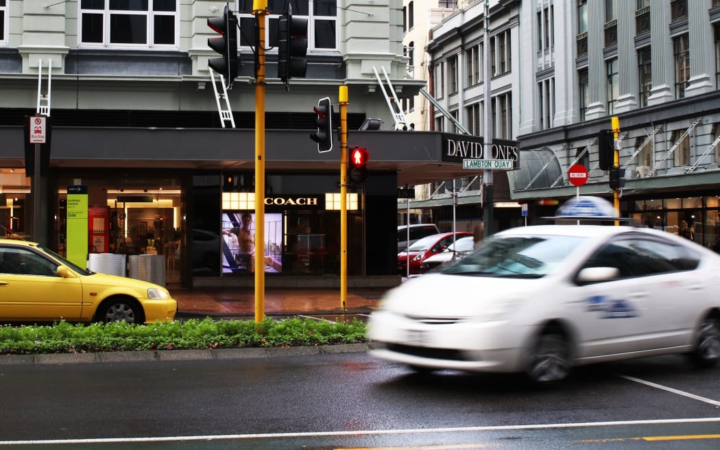 A car whizzes around a corner on Wellington's busy Lambton Quay.