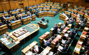 Leader of the House Chris Hipkins answers a question in the debating chamber.