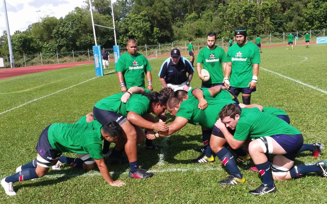 Tony Penn puts the Guam forwards through their paces.