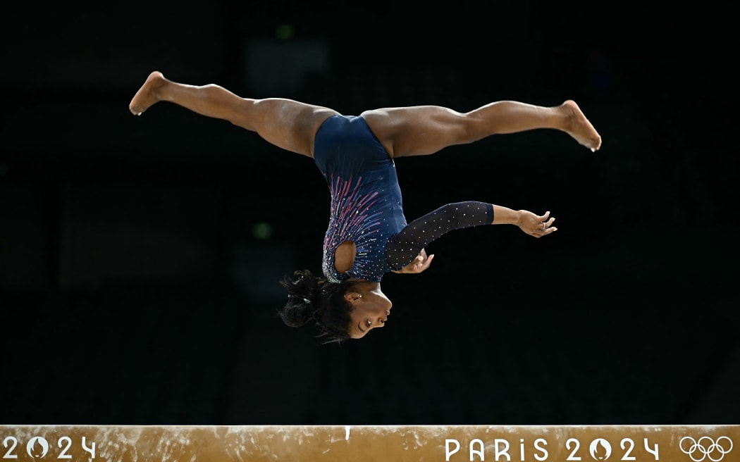 US' Simone Biles takes part in an artistic gymnastics training session at the Bercy Arena in Paris on July 25, 2024, ahead of the Paris 2024 Olympic Games. (Photo by Loic VENANCE / AFP)