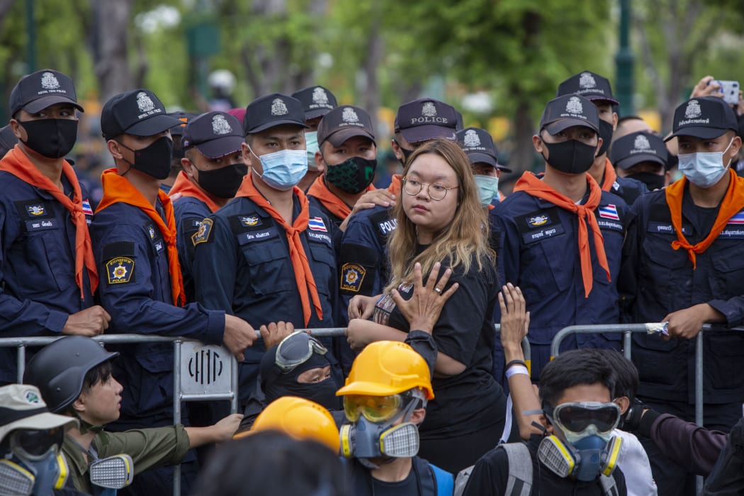 Panusaya 'Rung' Sithijirawattanakul at police lines near the Supreme Court after handing written demands to authorities, 20 September 2020.