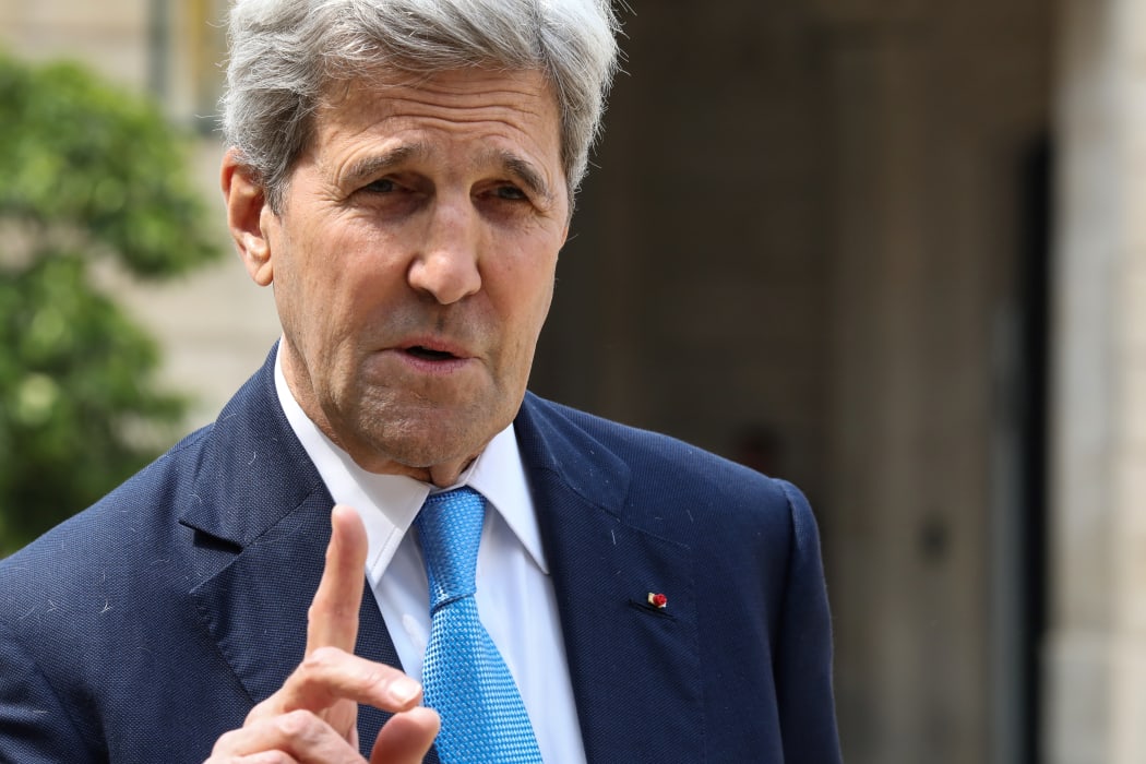 US former Secretary of State and member of the Carnegie foundation John Kerry gestures as speaks to the press while leaving the Elysee Palace in Paris, on May 23, 2018 after the "Tech for Good" summit. (Photo by ludovic MARIN / AFP)