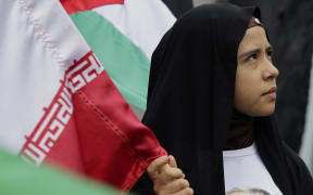 Members of the Mexican Association of Islamic Women and some Iranian women march to the Iranian Embassy in Mexico City.