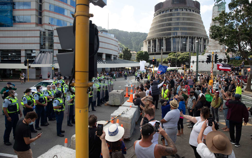 Protestors and Police standoff as police move concrete barricades