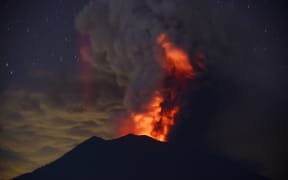 Mount Agung erupts at night.