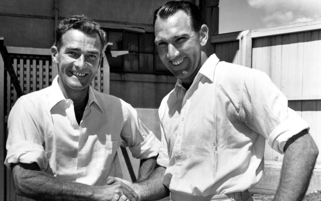 New Zealand cricket players Bert Sutcliffe (l) and John Reid (r) shake hands at the Plunket Shield Cricket competition, 1959.