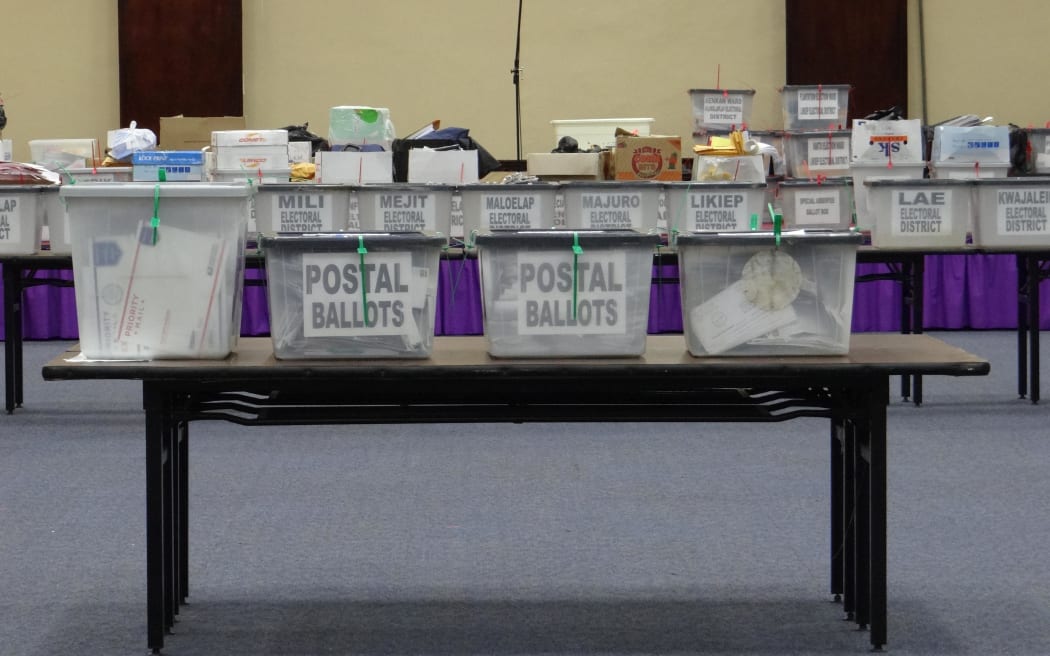 Boxes of postal absentee ballots cast in the 2015 national election await tabulation in Majuro in this file photo from 2015.
