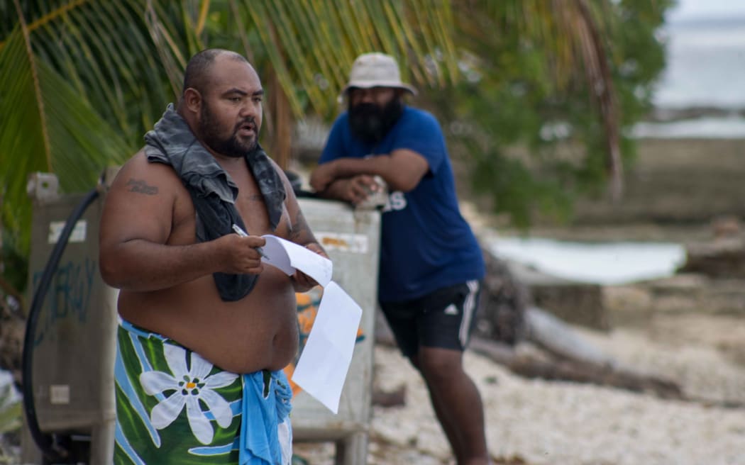 Petelo Iosefo reading out household names at inati