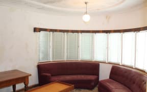 One of the original Art Deco lights in the feature bay window.