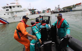 Members of a rescue team prepare to search for survivors from the Lion Air flight JT 610, which crashed into the sea.