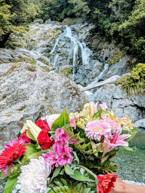 Flowers from Stephanie Simpon's family and friends were taken by Hanson to Fantail Falls, near where the tramper died.