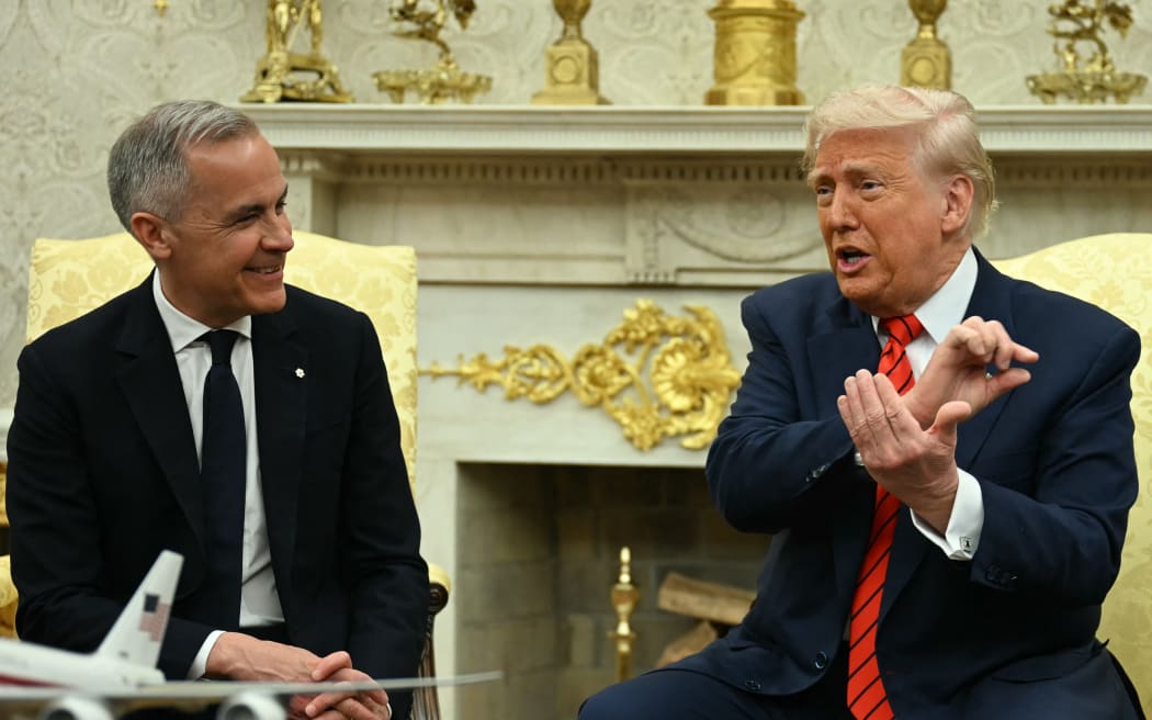 US President Donald Trump meets with Canadian Prime Minister Mark Carney in the Oval Office of the White House in Washington, DC, on May 6, 2025. (Photo by Jim WATSON / AFP)