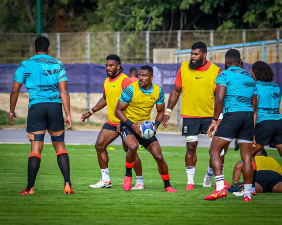 Jiuta Wainiqolo attacks with the ball at training.