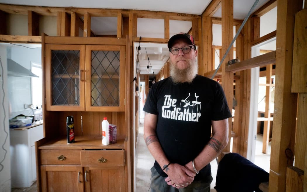 Rānui resident Mark Griffin in his flood-damaged home.