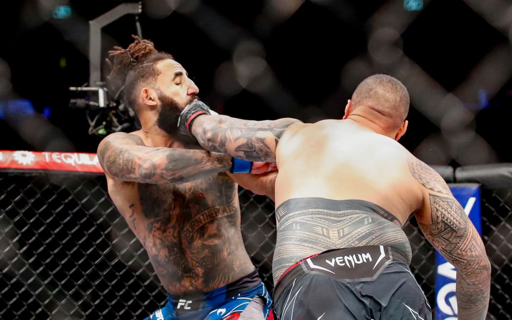 Justin Tafa hits Austen Lane with a knockout right hand. UFC 293, Qudos Bank Arena, Sydney Olympic Park Australia, Sunday 10th September 2023.  Copyright Photo: David Neilson / www.photosport.nz