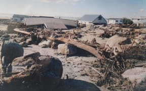 Homes in Matata were destroyed when intense rain forced debris into the community in 2005.