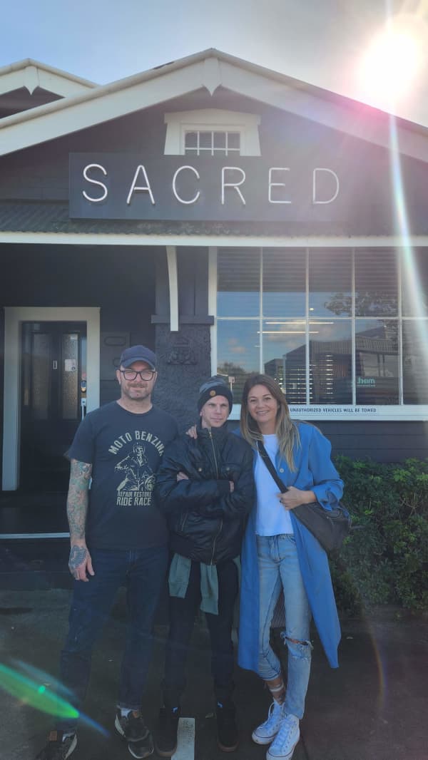 Tattoo artist Dan Anderson and Alison Brewer with her brother after they both got tattooed.