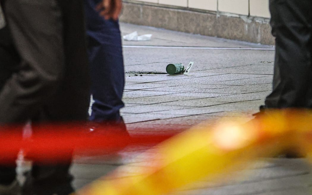 This picture taken and released by Taiwan’s Central News Agency (CNA) on December 19, 2025 shows a smoke grenade after it was thrown at Taipei Main Station, in Taipei. Taiwan's government raised security levels at major transportation stations after a man threw smoke grenades and attacked people in two busy metro stations, injuring at least eight people, officials said. (Photo by CHENG CHING-YUAN / Central News Agency (CNA) / AFP) / Taiwan OUT - Macau OUT - China OUT / TAIWAN OUT - MACAU OUT - CHINA OUT / TAIWAN OUT - MACAU OUT - CHINA OUT / HONG KONG OUT
RESTRICTED TO EDITORIAL USE - MANDATORY CREDIT "AFP PHOTO / CNA PHOTO" - NO MARKETING - NO ADVERTISING CAMPAIGNS - DISTRIBUTED AS A SERVICE TO CLIENTS /