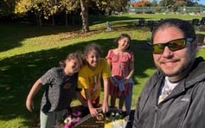 John Bryers Ruddock pictured with his children, who are 8, 9 and 12.